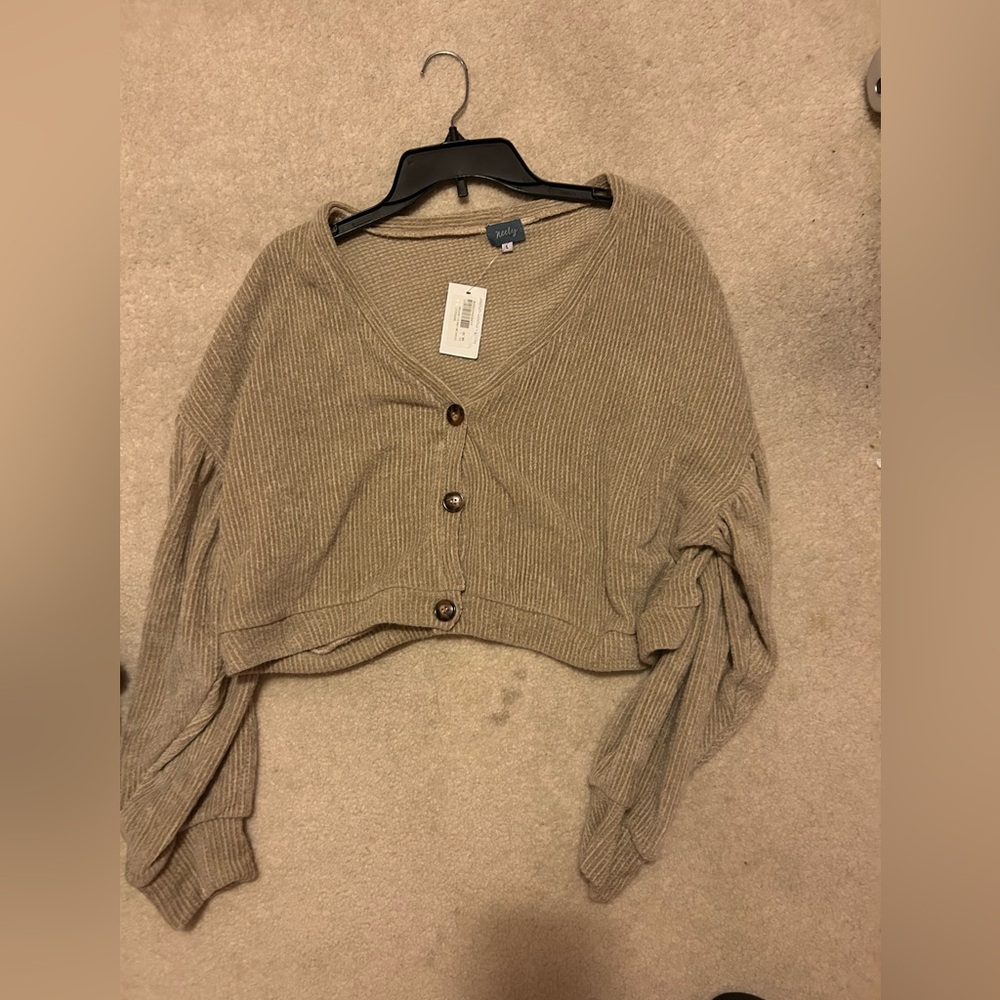 South moon under beige sweater